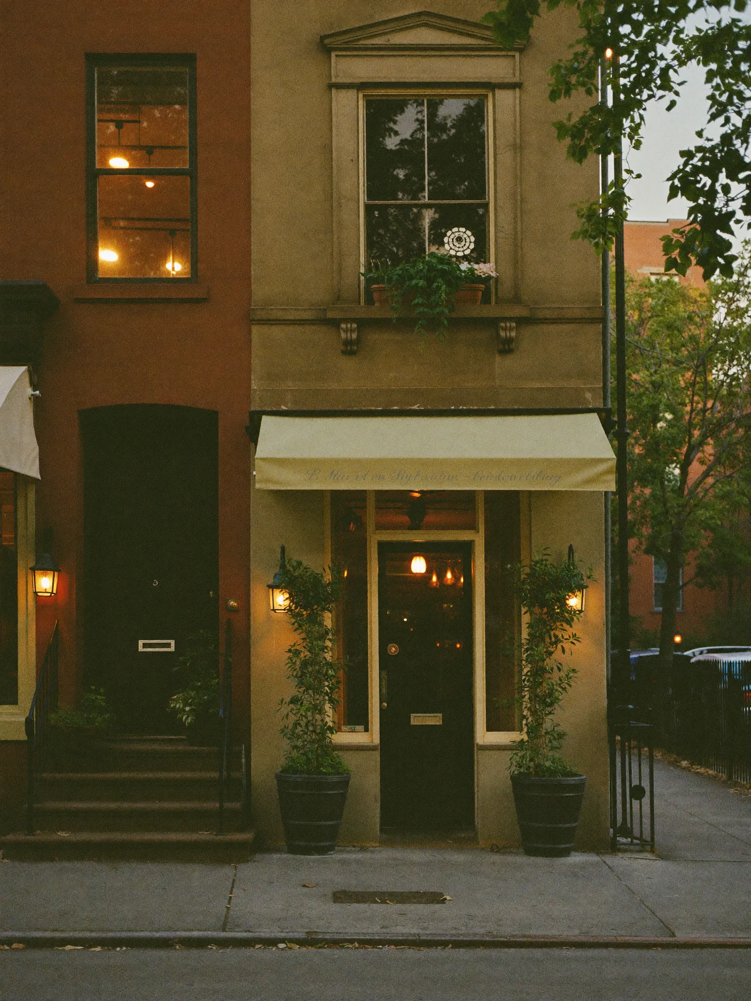 A Brooklyn shopfront block in late afternoon light